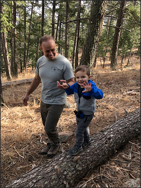 Outdoor School child with adult in the woods