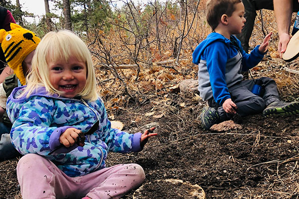 Kids on the ground in outdoor school program at Cheyenne Mountain Zoo